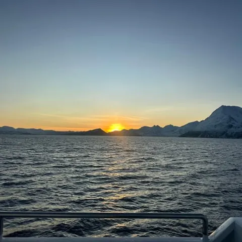 The Arctic sunset seen from the boat's deck