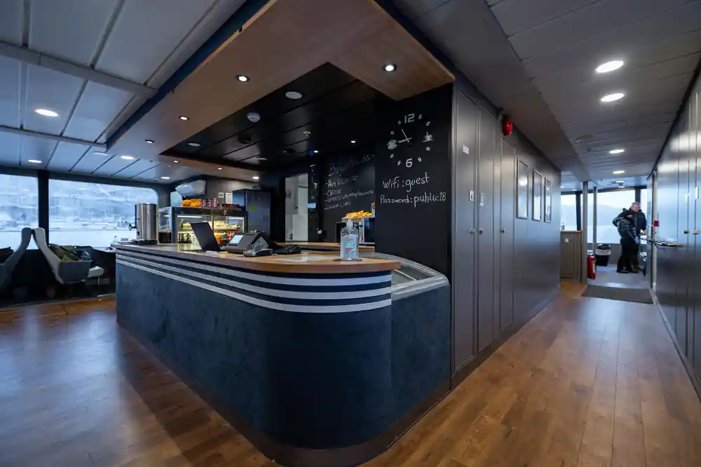 Modern boat cafe counter with black and wood finishes